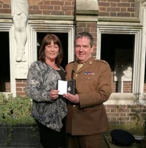 Dennis, Safety First Aid Training's senior first aid instructor, receiving his Order of St John membership medal